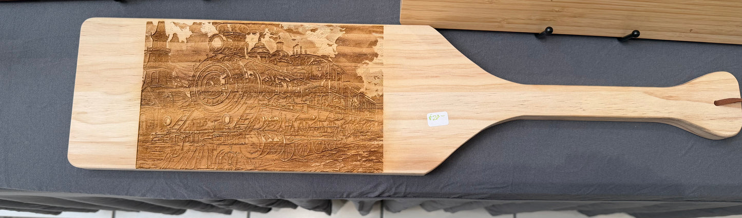 Train laser engraved on wooden paddle