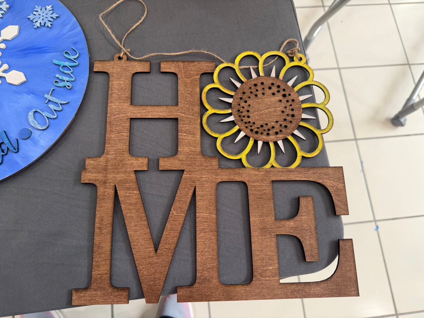 Home sign with flower