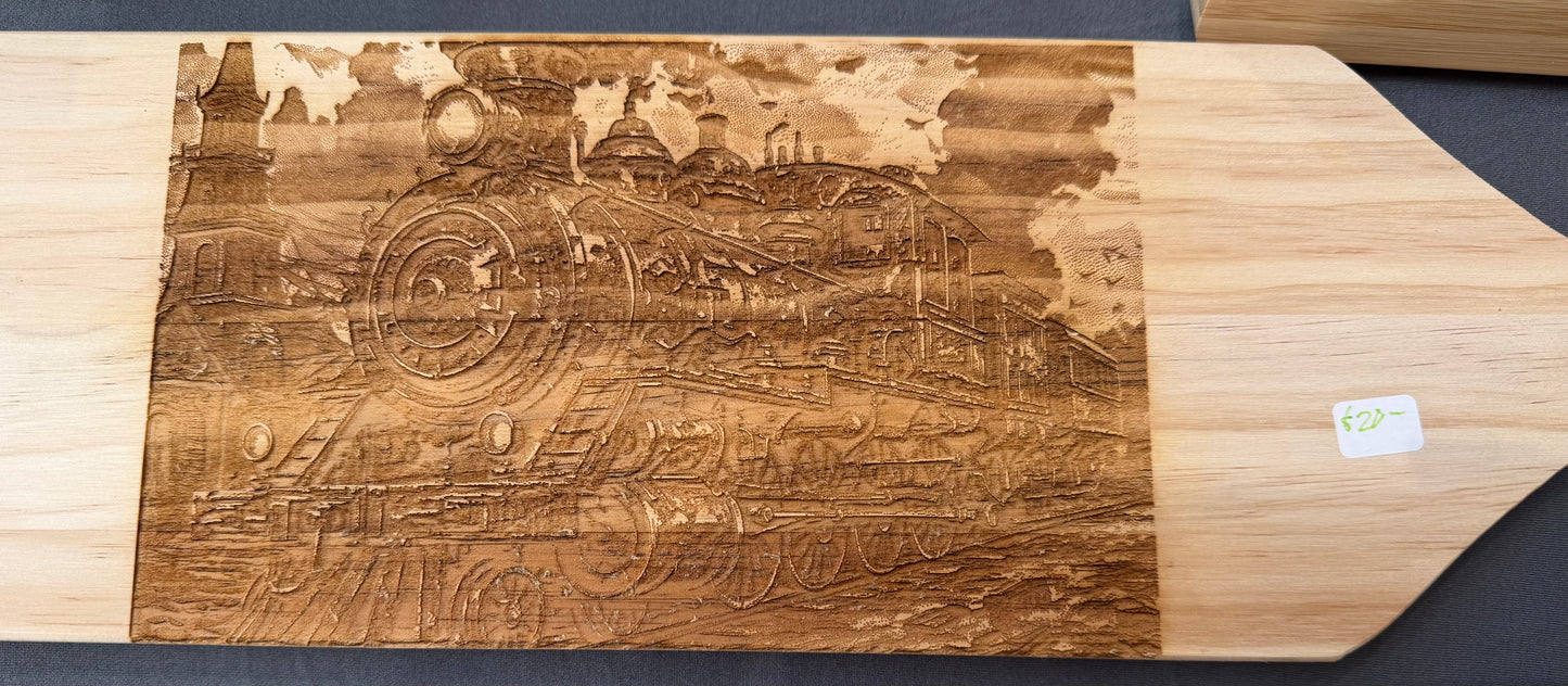 Train laser engraved on wooden paddle